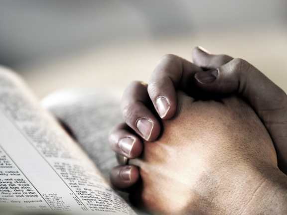 Praying-hands-with-bible